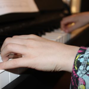 Hands on a piano